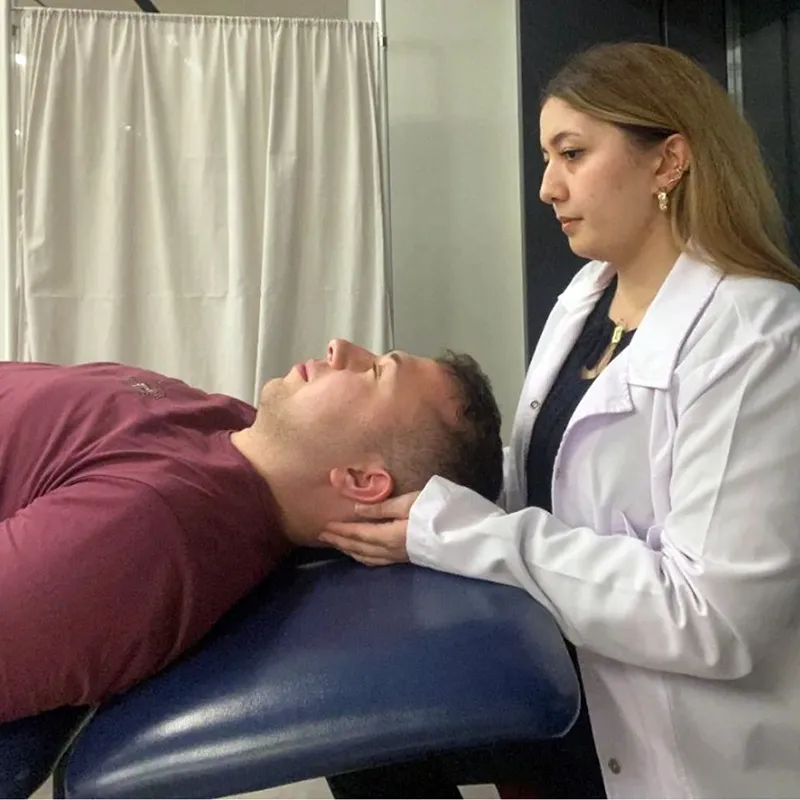 A practitioner applying a sham no-pressure technique.