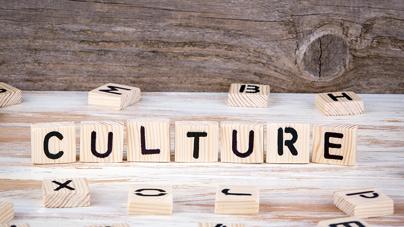 Culture from wooden letters on wooden background.