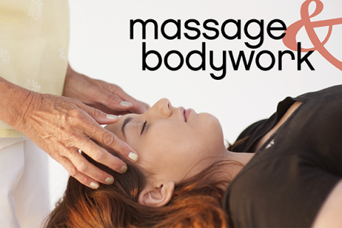 A practitioner administers an Ayurveda modality to a woman's head.