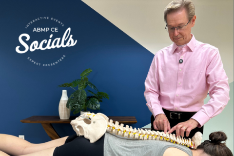 Massage therapist Doug Nelson works with a client.