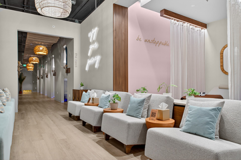 A spa hallway with comfy chairs.