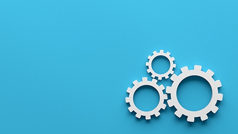 Cogwheels or gears on blue background.