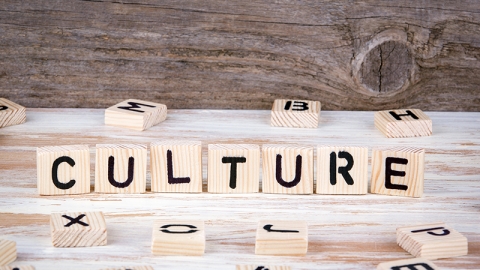 Culture from wooden letters on wooden background.