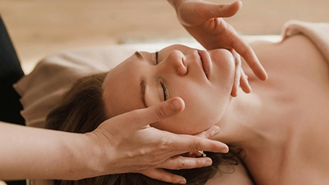 Image of a person receiving a facial massage.