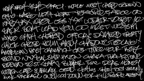 A blackboard crammed with words written messily in chalk